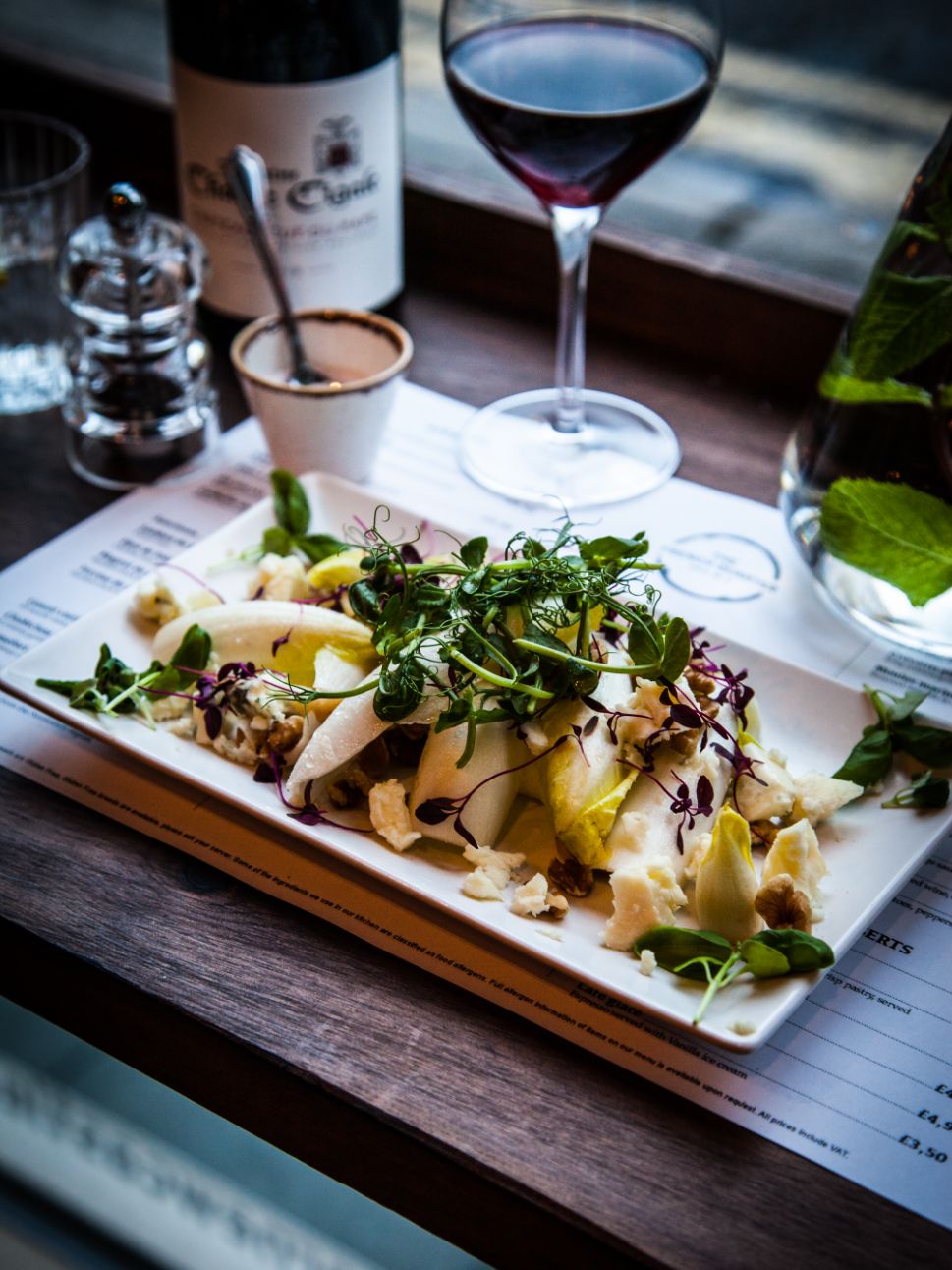 Traditional french dish accompanied with a glass of red wine